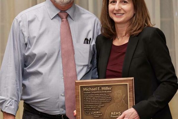 Mike_Miller_award_and_sister_Beth